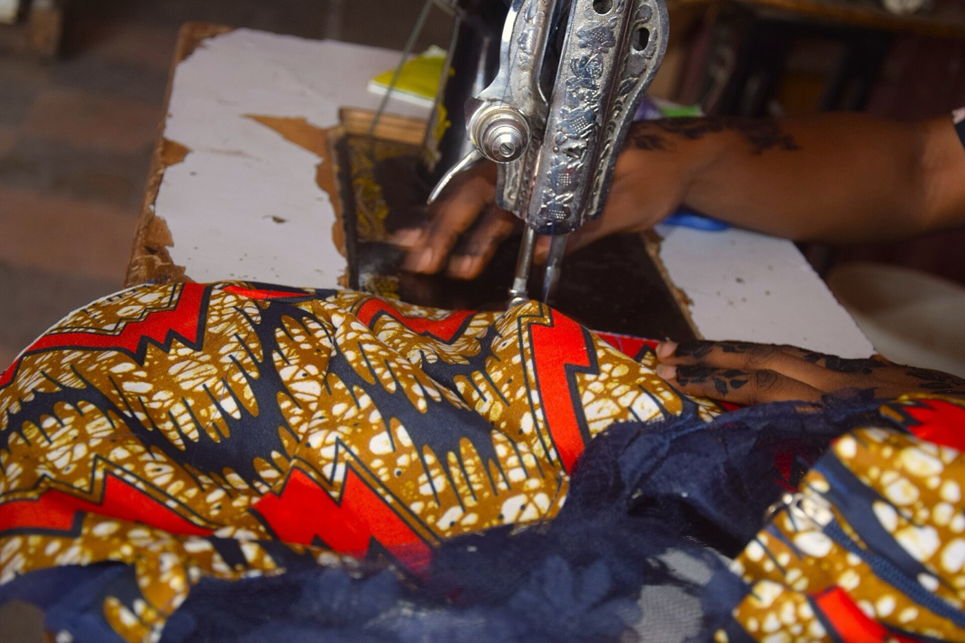 Ankara fabric being sewn into a garment