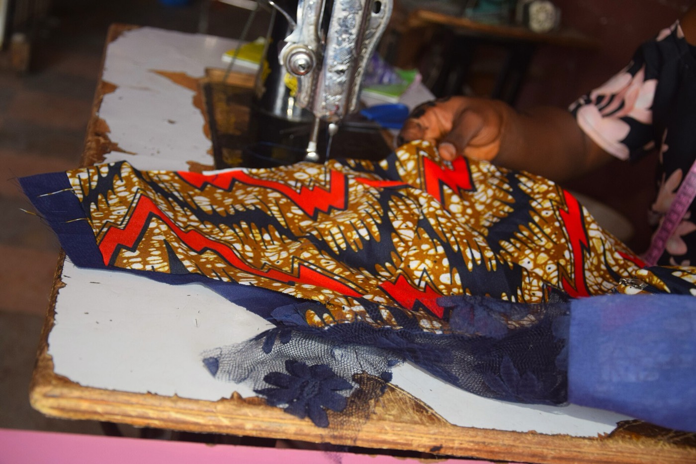 Ankara fabric being sewn on a machine